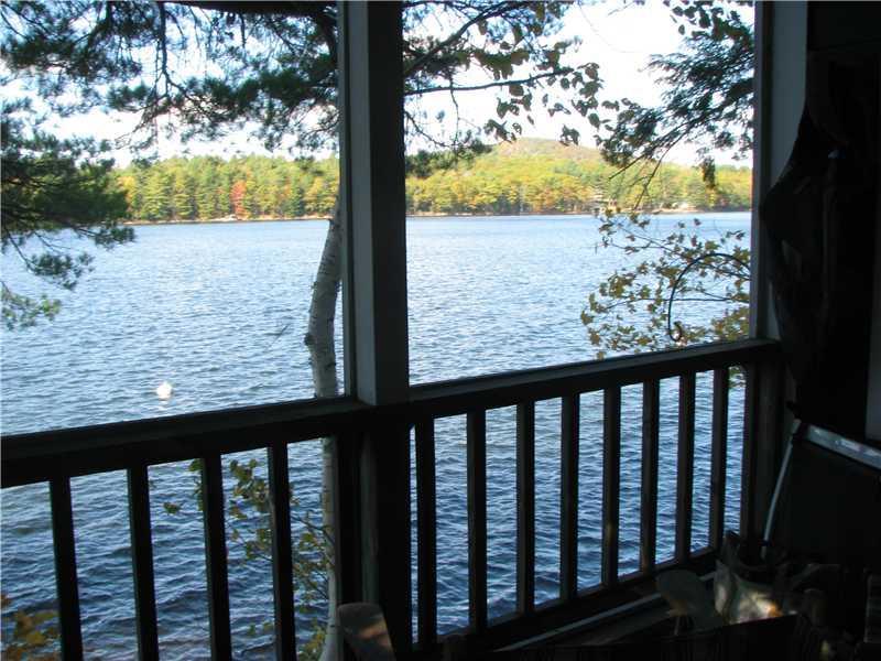 167 Crystal Spring Lane, Unit 20 Rome, ME 04963 - Photo 15 of 31 Other. Screened in porch over the water.