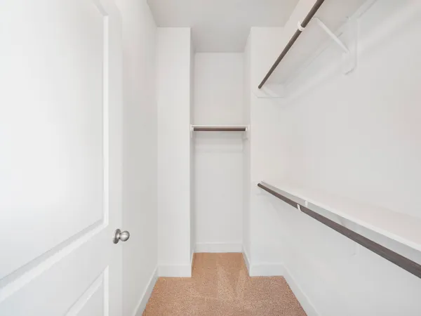 a bathroom with a double vanity sink toilet and shower