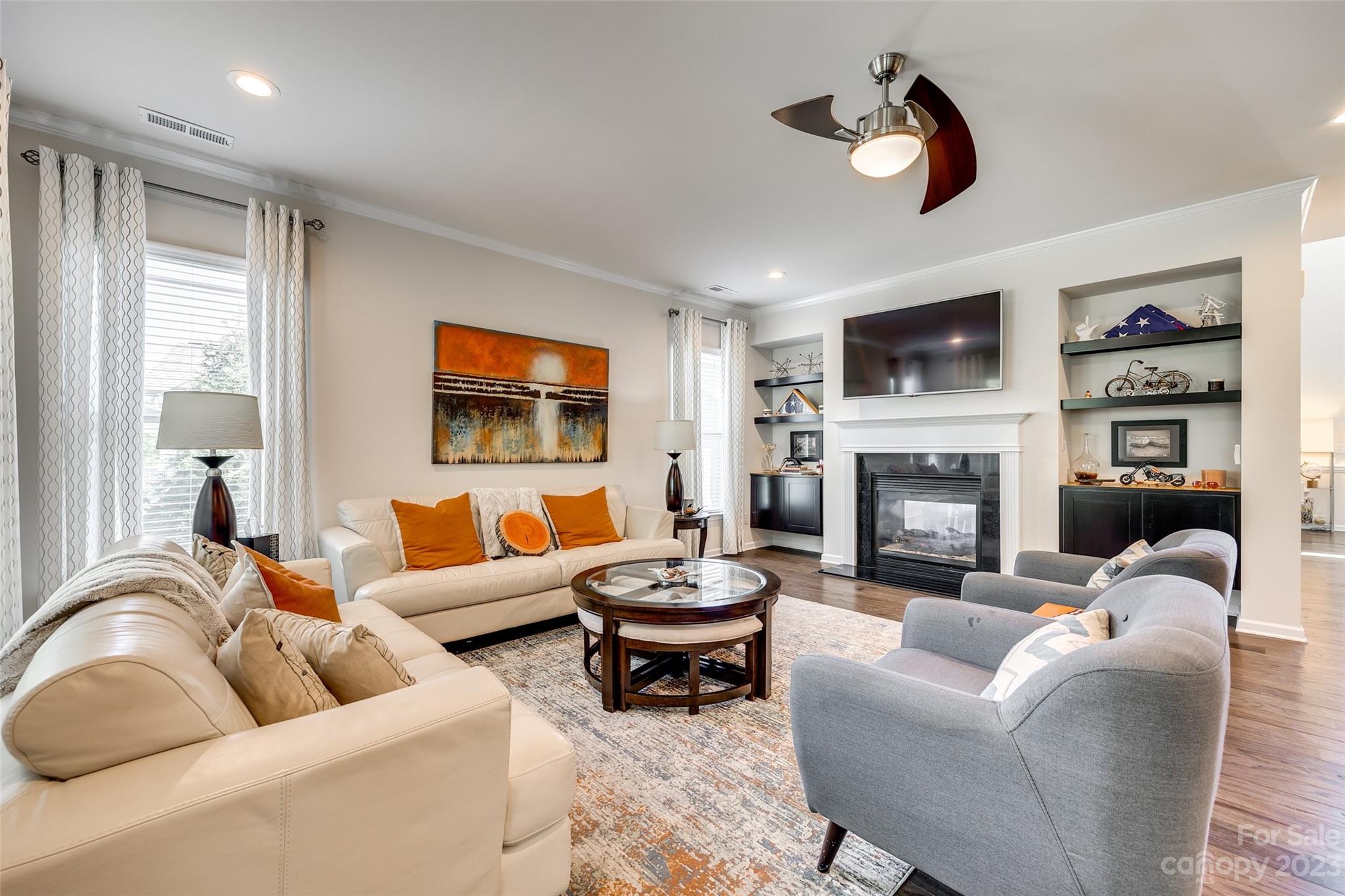 423 Harrier Crossing Circle Fort Mill, SC 29708 - Photo 11 of 36 a living room with furniture fireplace and a large window