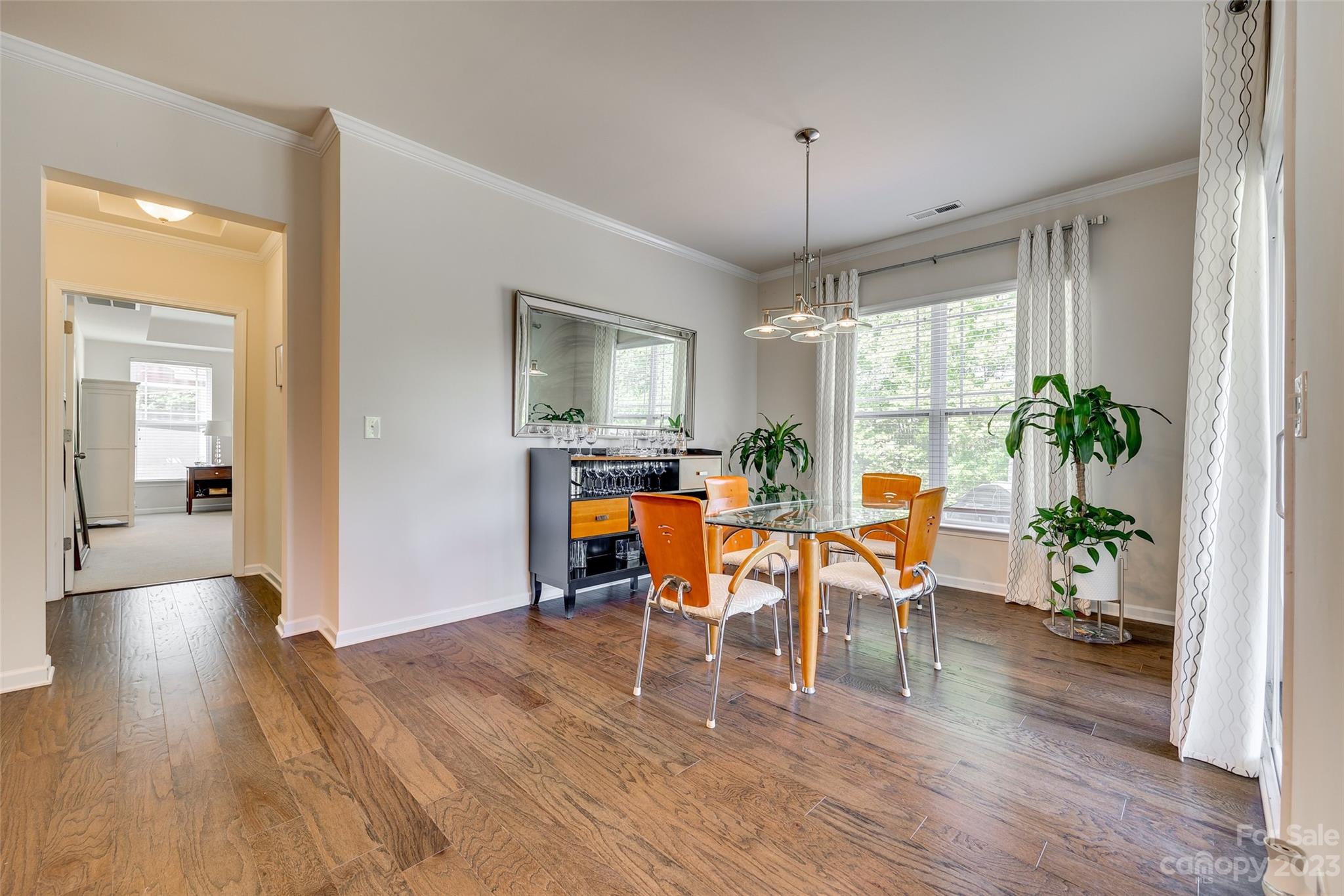 423 Harrier Crossing Circle Fort Mill, SC 29708 - Photo 18 of 36 a view of a dining room with furniture window and wooden floor