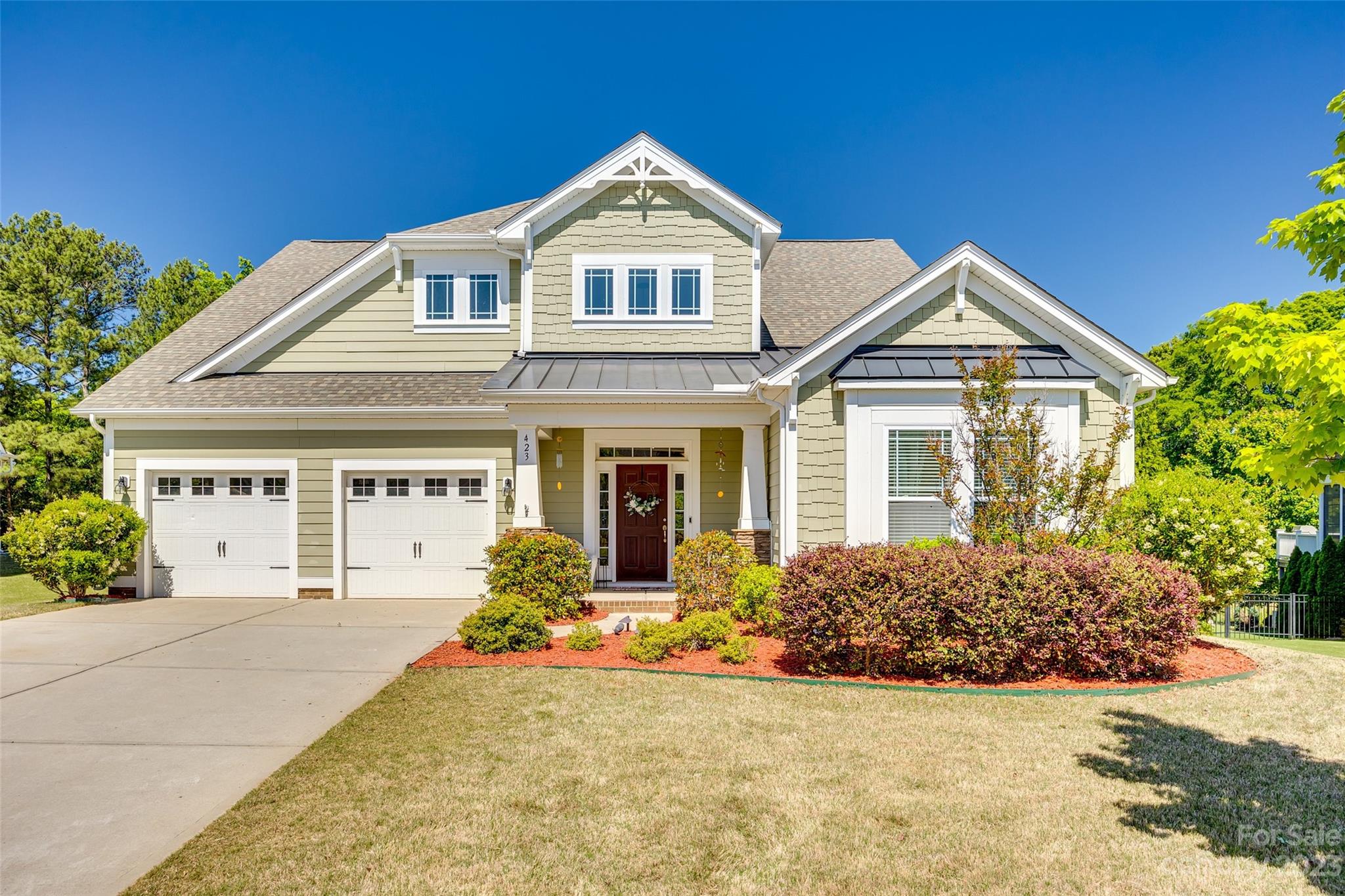 423 Harrier Crossing Circle Fort Mill, SC 29708 - Photo 2 of 36 a front view of a house with a yard