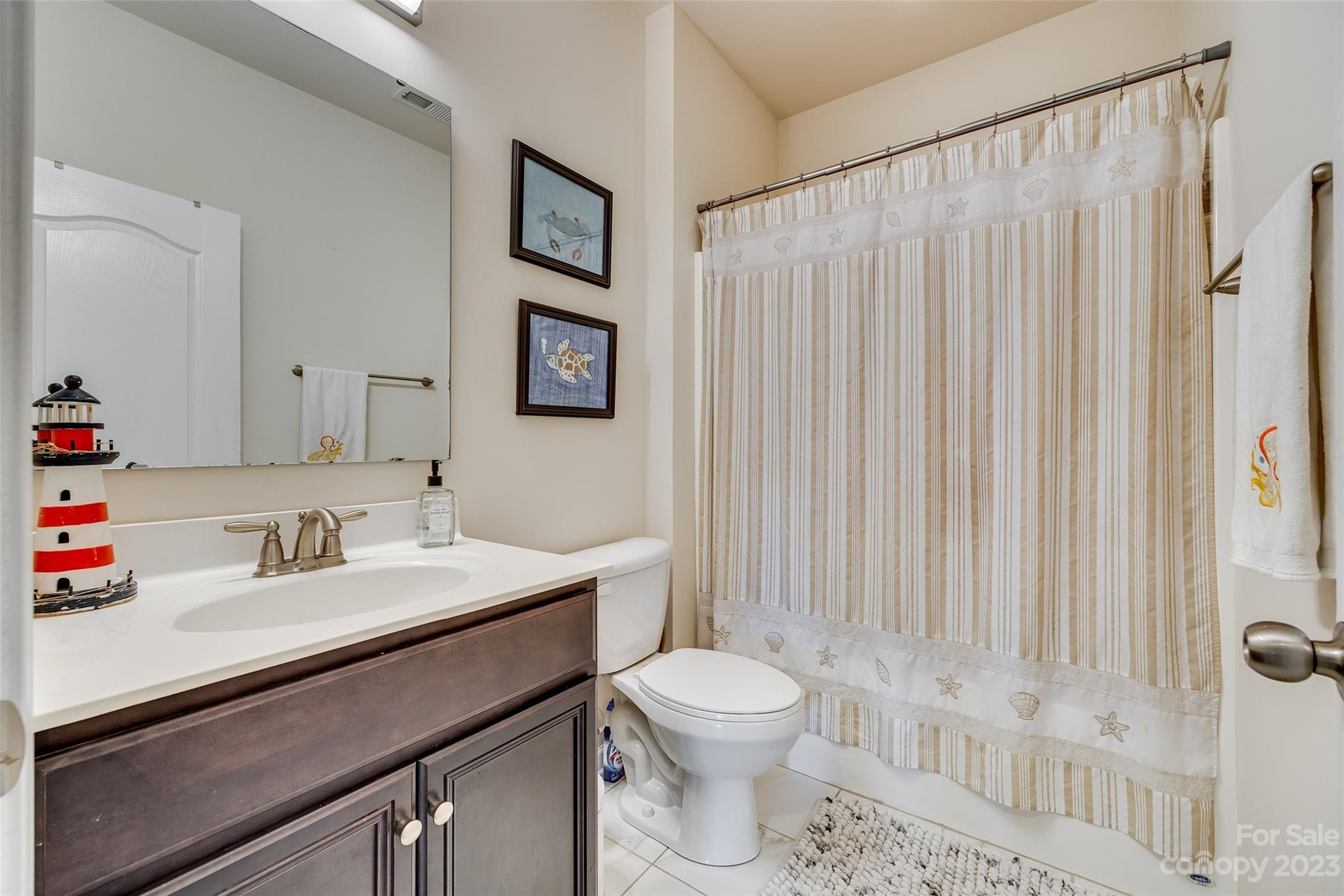 423 Harrier Crossing Circle Fort Mill, SC 29708 - Photo 28 of 36 a bathroom with a sink toilet and shower