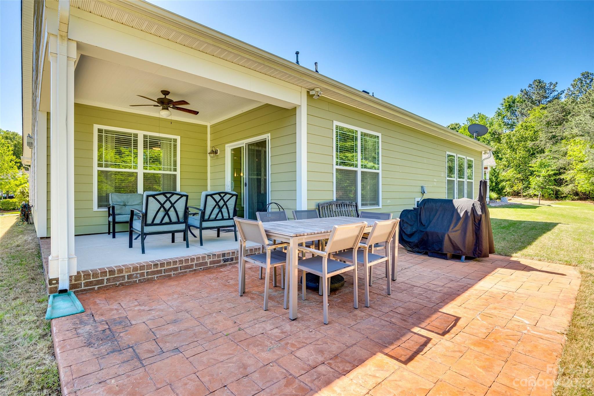 423 Harrier Crossing Circle Fort Mill, SC 29708 - Photo 32 of 36 a view of a patio with a dining table and chairs