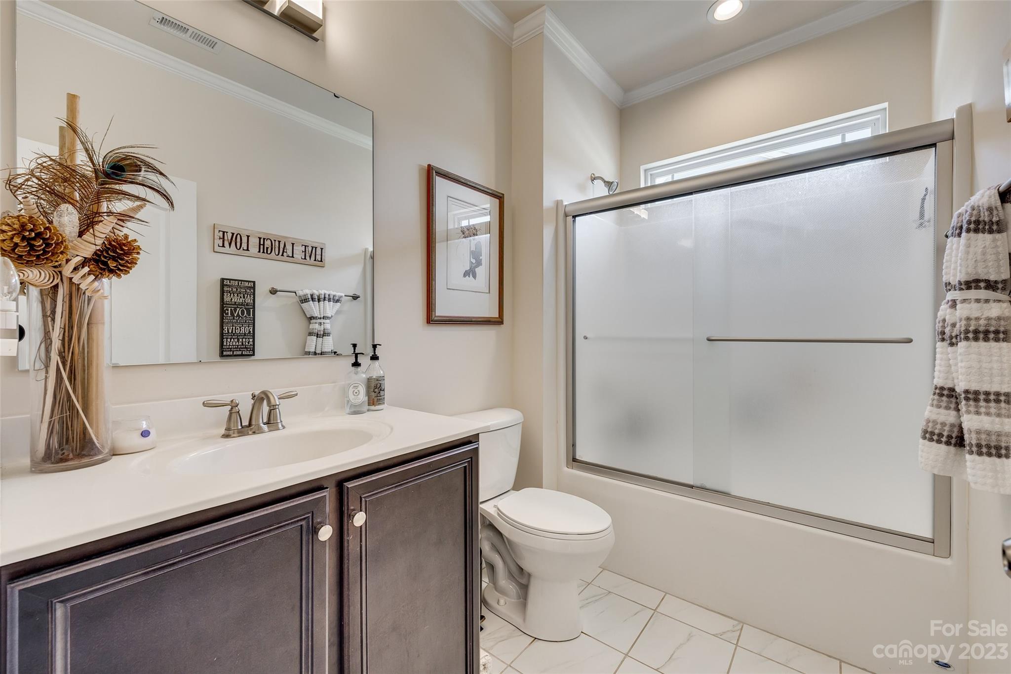 423 Harrier Crossing Circle Fort Mill, SC 29708 - Photo 7 of 36 a bathroom with a sink a toilet and shower