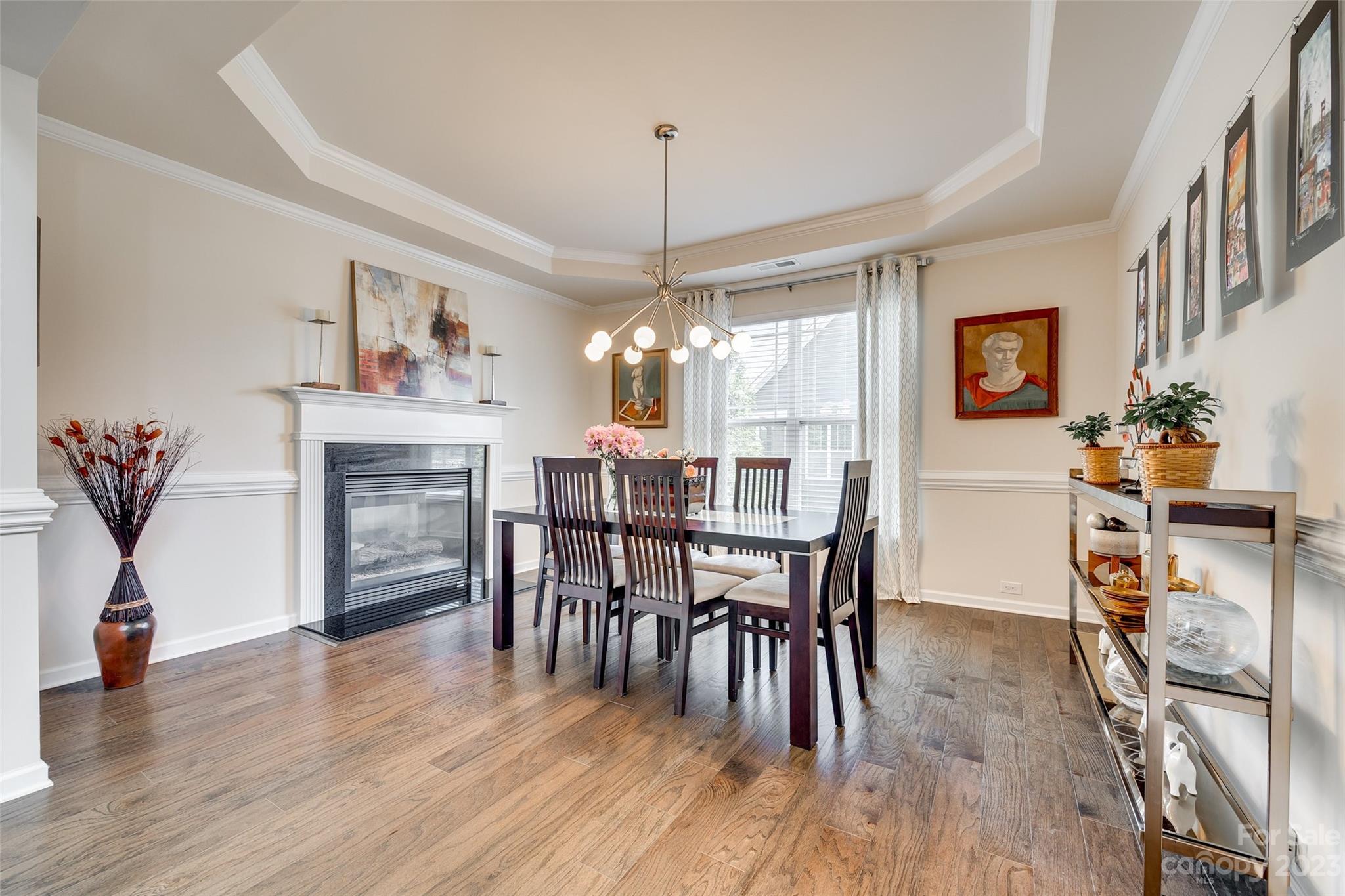 423 Harrier Crossing Circle Fort Mill, SC 29708 - Photo 8 of 36 a view of a dining room with furniture window and wooden floor