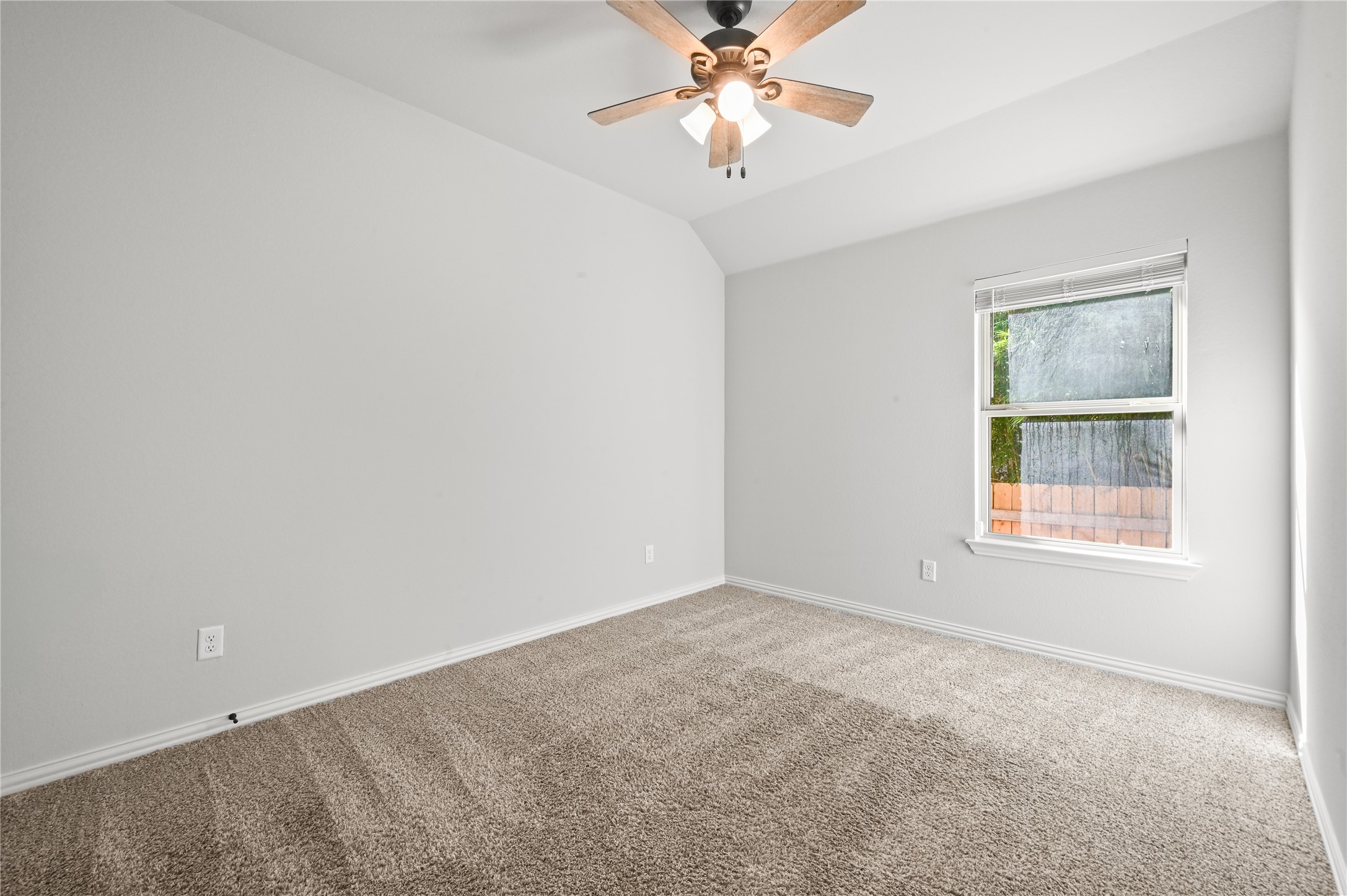 426 Cold Riv Run Kyle, TX 78640 - Photo 23 of 34 A comfortable bedroom boasts soft carpet and a window for natural light.