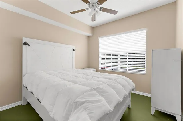 a bedroom with a bed and window