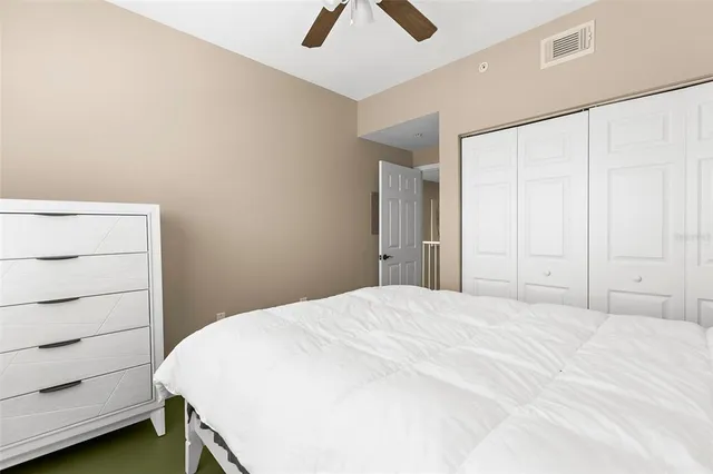 a large white bed in a white room