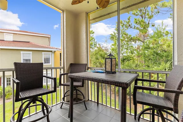 a view of a dining room with furniture and a window