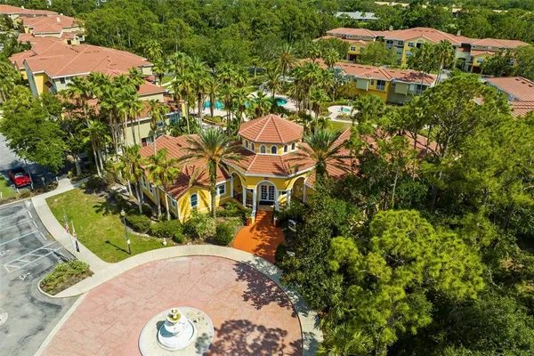 an aerial view of a house with a garden and yard