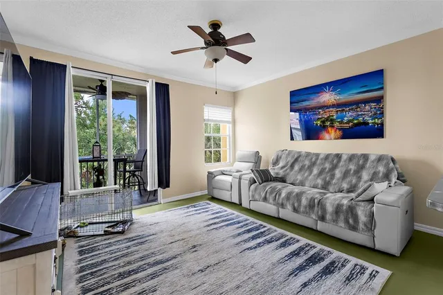 a living room with furniture and large windows