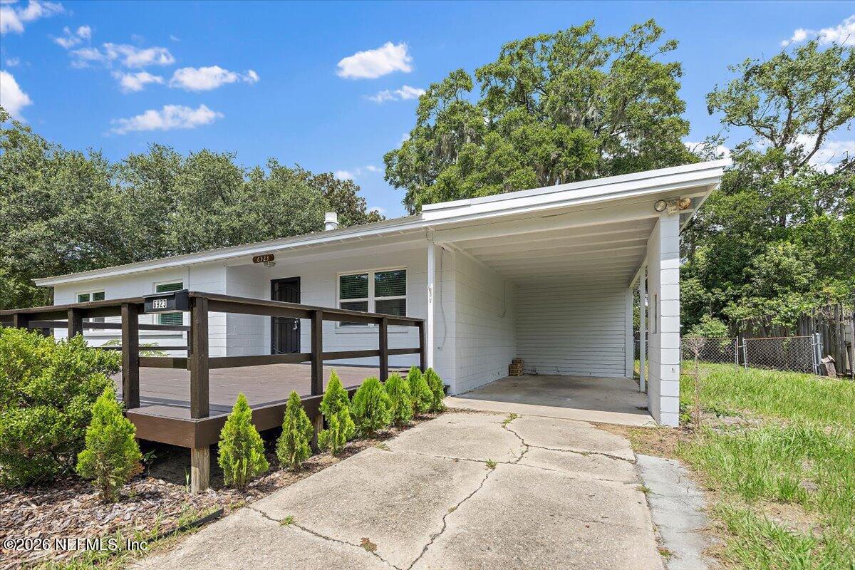 6923 Gaillardia Road South Jacksonville, FL 32211 - Photo 16 of 31 a view of a house with a yard