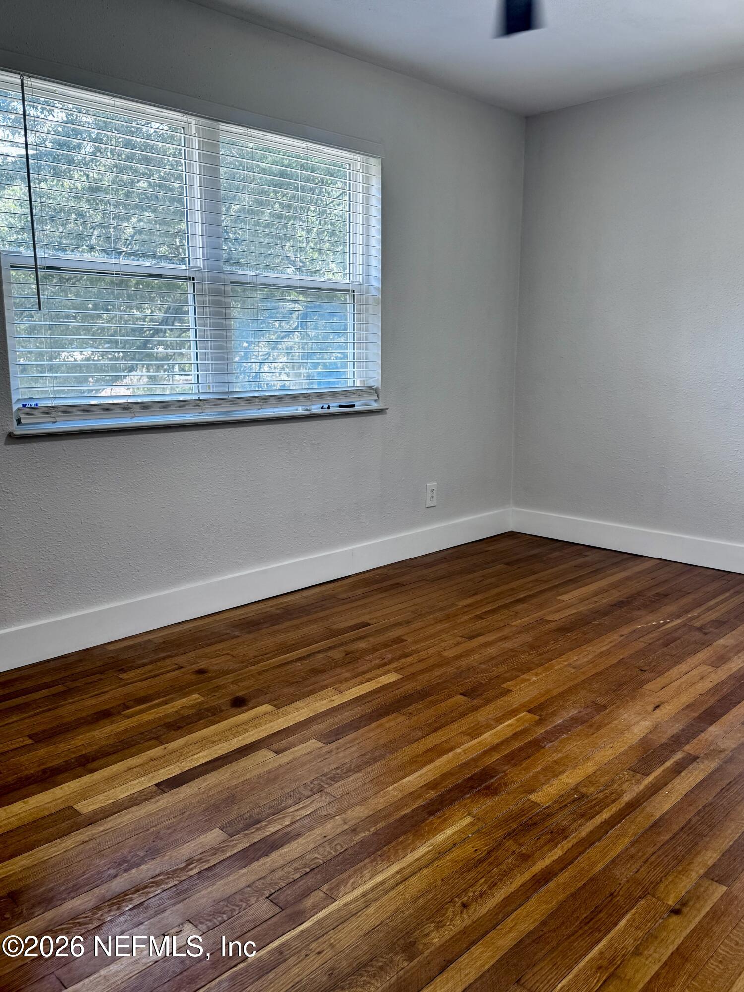 6923 Gaillardia Road South Jacksonville, FL 32211 - Photo 29 of 31 a view of a room with wooden floor and windows