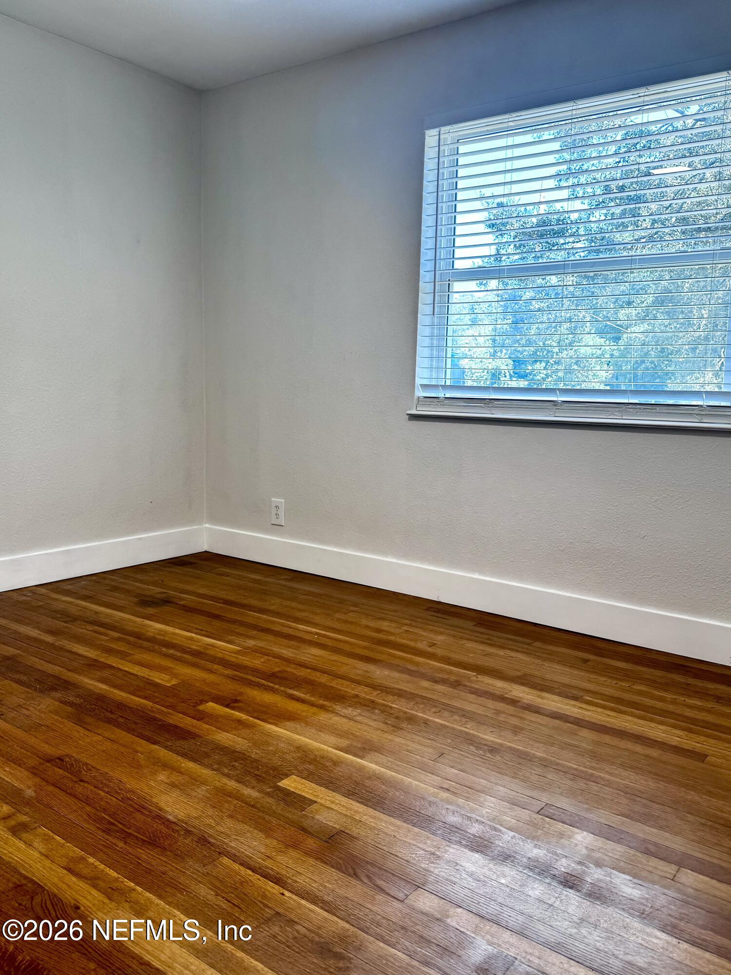 6923 Gaillardia Road South Jacksonville, FL 32211 - Photo 30 of 31 a view of a room with wooden floor and a window