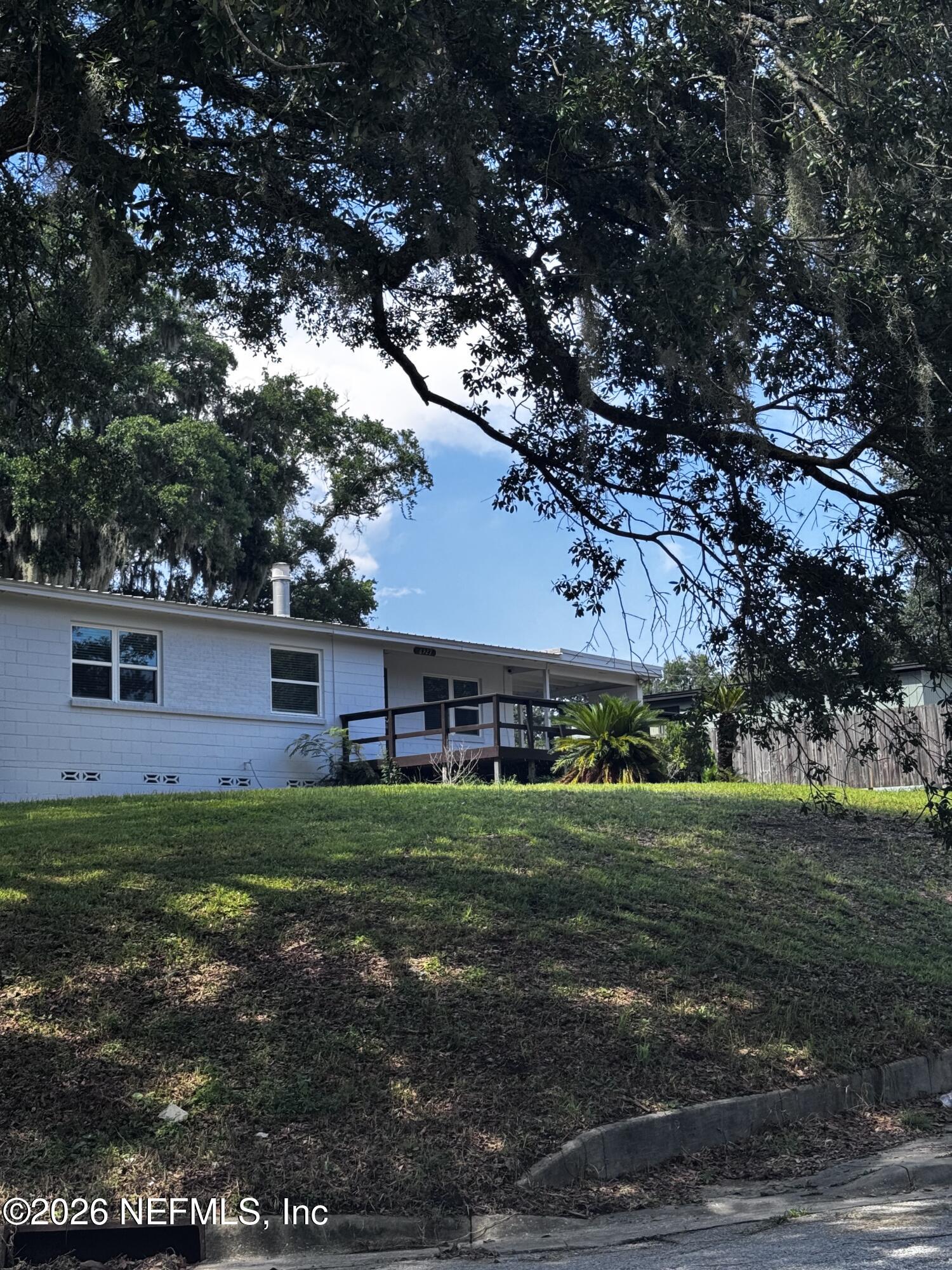 6923 Gaillardia Road South Jacksonville, FL 32211 - Photo 31 of 31 a view of a house with a yard