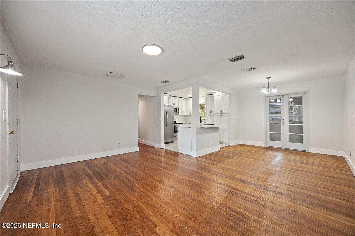 6923 Gaillardia Road South Jacksonville, FL 32211 - Photo 4 of 31 a view of a kitchen with wooden floor and windows
