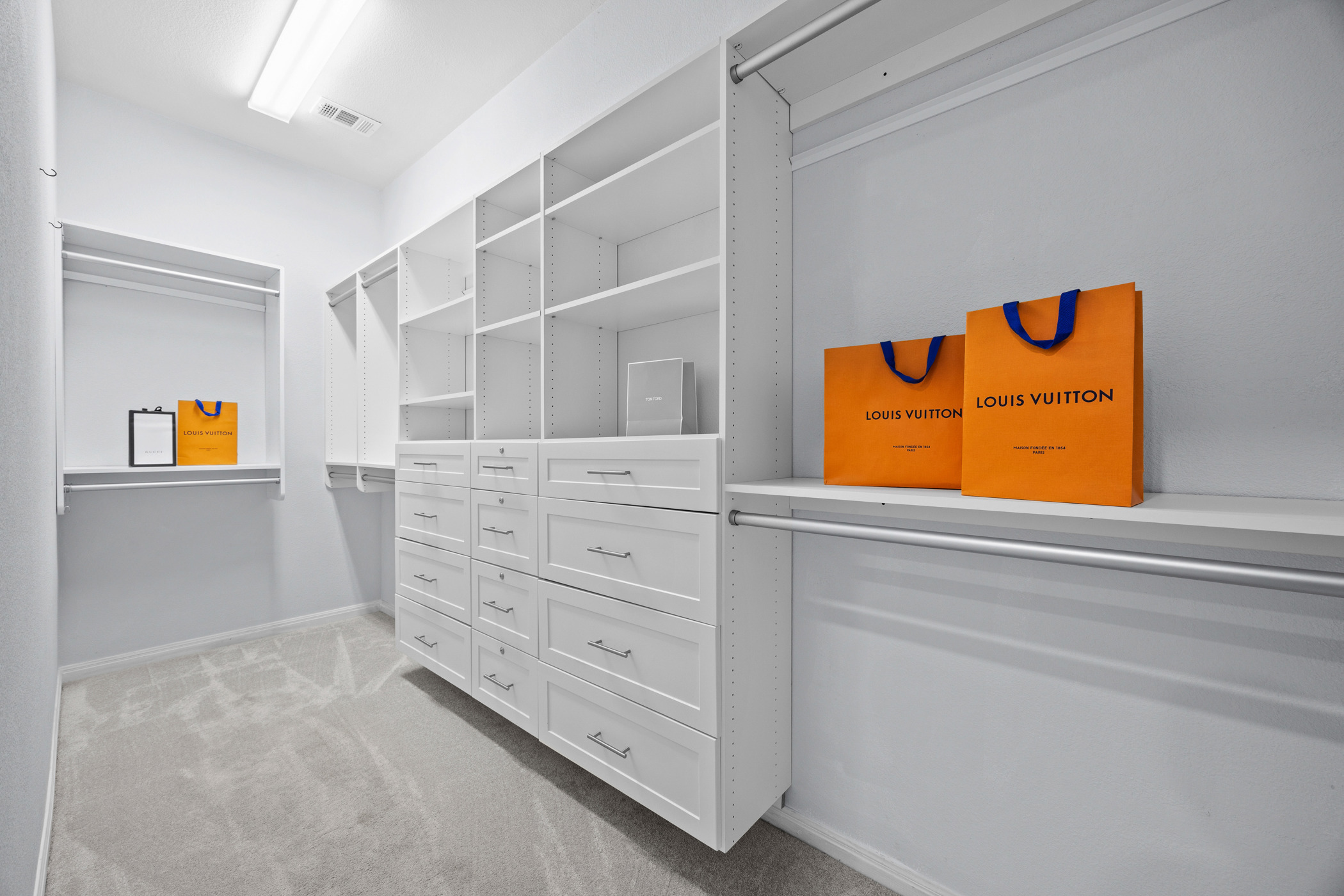 2300 Lakehurst Road Spicewood, TX 78669 - Photo 16 of 40 Walk in closet featuring light carpet