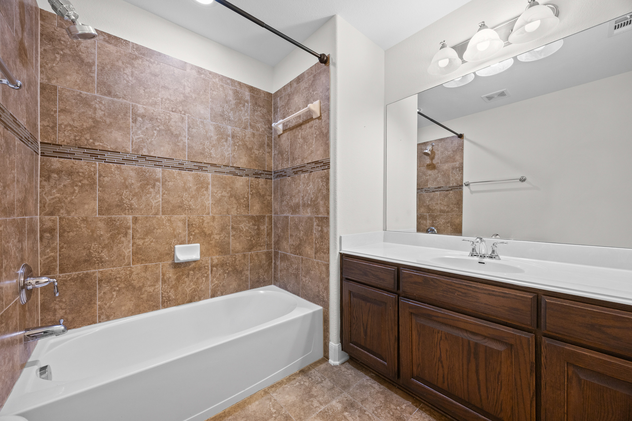 2300 Lakehurst Road Spicewood, TX 78669 - Photo 27 of 40 Bathroom featuring vanity and bathtub / shower combination
