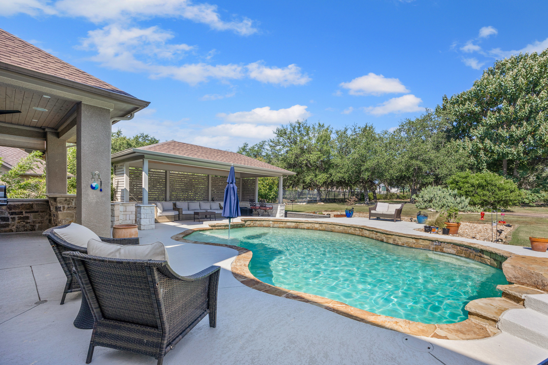 2300 Lakehurst Road Spicewood, TX 78669 - Photo 34 of 40 Swimming pool with an outdoor living space and a patio area