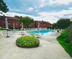 a view of a swimming pool with a yard