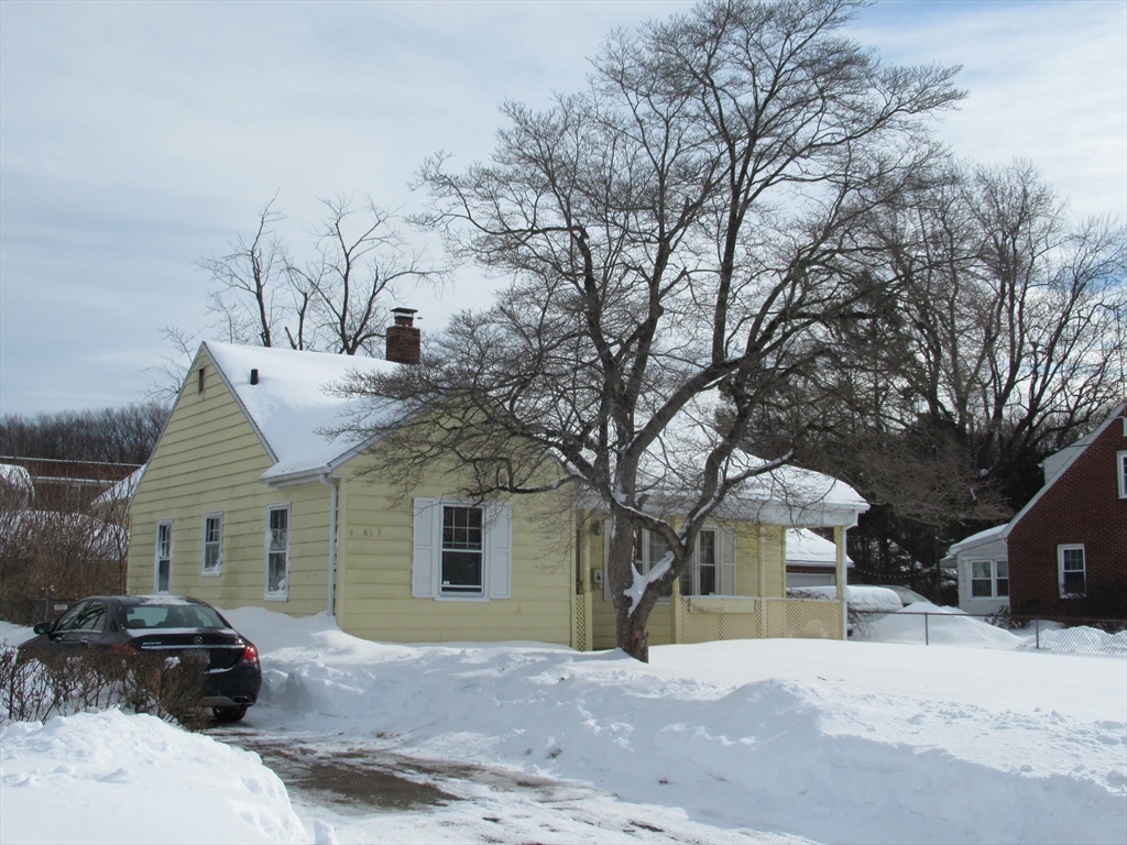 33 Connolly Street Springfield, MA 01151 - Photo 2 of 6 a front view of a house with a yard