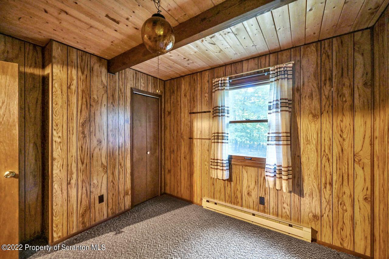1038 Beaver Run Road Newfoundland, PA 18445 - Photo 14 of 34 a view of an empty room with wooden walls