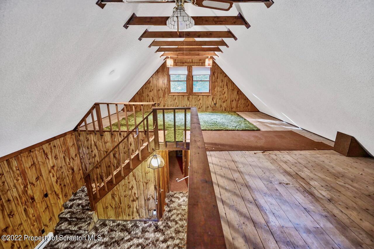 1038 Beaver Run Road Newfoundland, PA 18445 - Photo 26 of 34 a bedroom with a bed and wooden floor