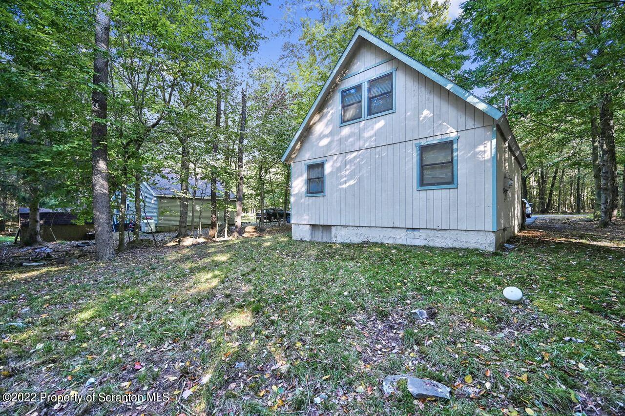 1038 Beaver Run Road Newfoundland, PA 18445 - Photo 31 of 34 a view of a backyard with barn and large trees
