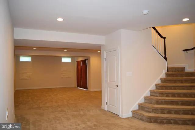 a view of an empty room with racks on the wall
