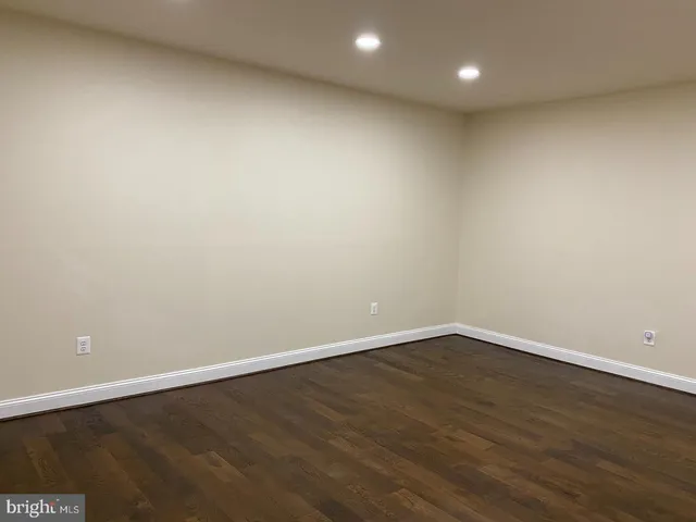 a view of a wooden deck and a yard