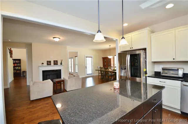 a view of a kitchen and dining room