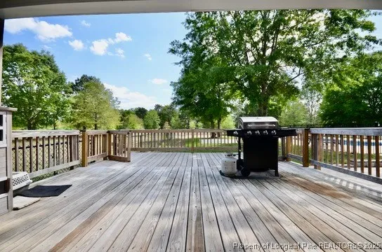 a view of deck with wooden floor and fence