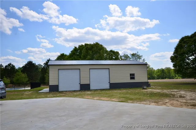 a view of a house with a backyard
