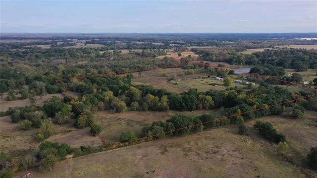 an aerial view of lot of residential houses with outdoor space