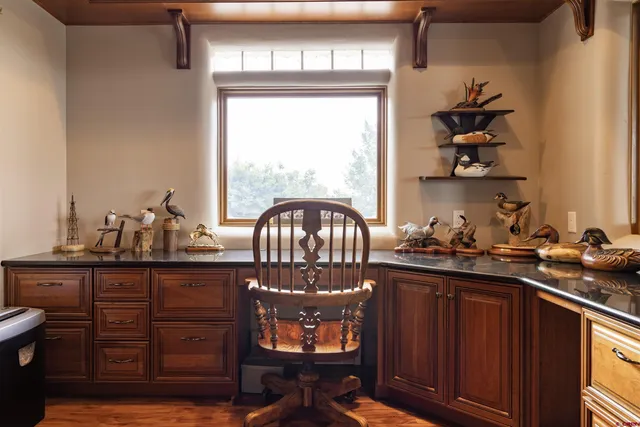 a kitchen with sink refrigerator and cabinets