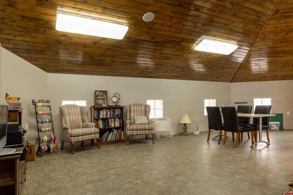 a view of a livingroom with furniture and toys
