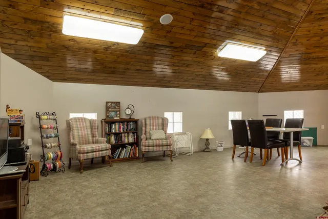 a view of a livingroom with furniture and toys