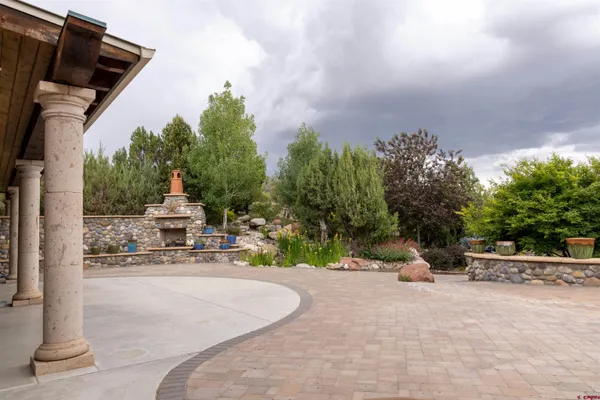 a view of outdoor space with seating area and trees around