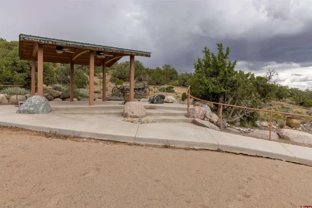a view of a patio with table and chairs and potted plants