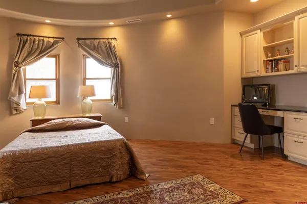 a bathroom with a granite countertop shower and a toilet