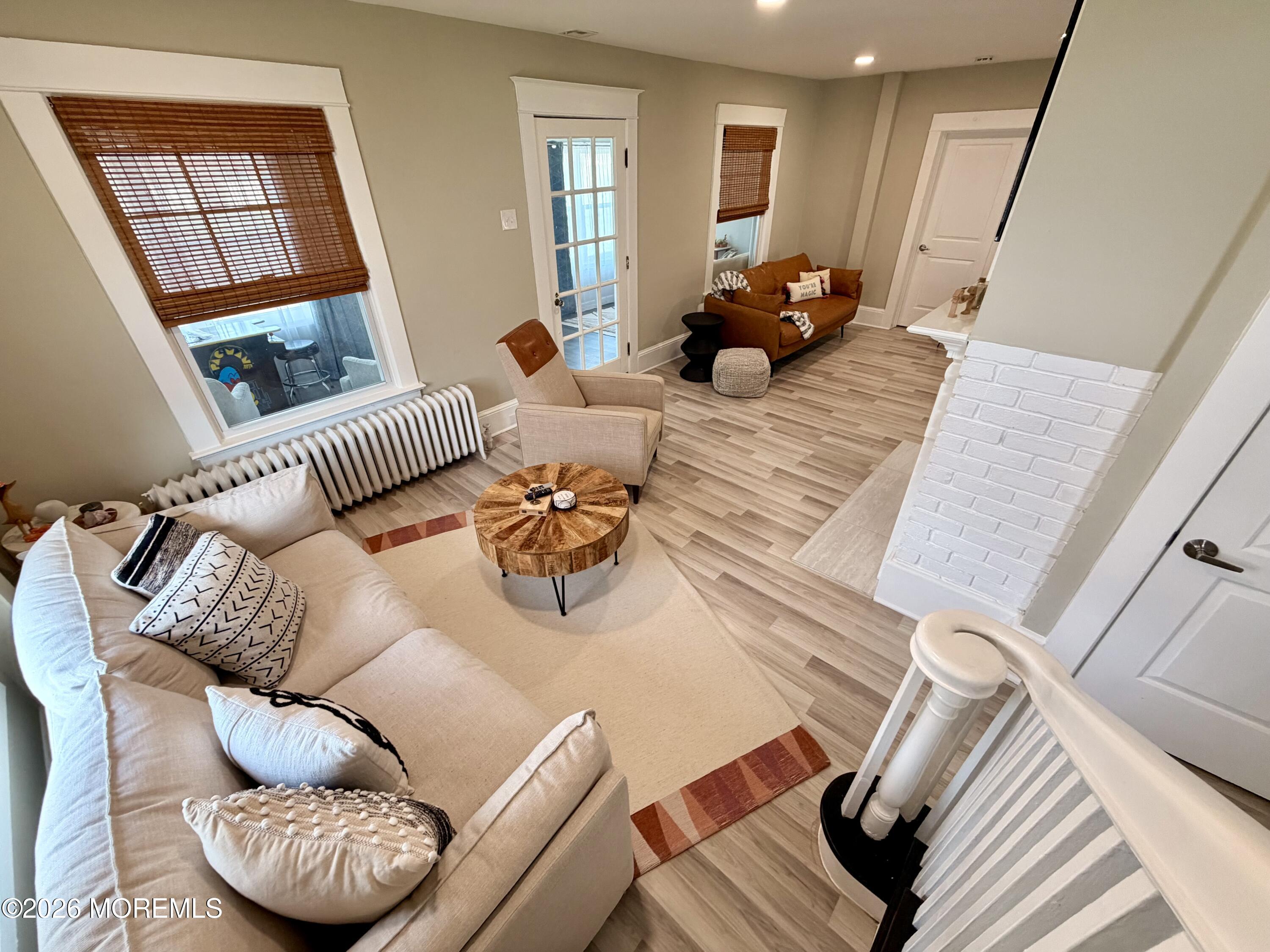 4053 Nottingham Way Hamilton Square, NJ 08690 - Photo 3 of 14 a living room with furniture or couch and a wooden floor