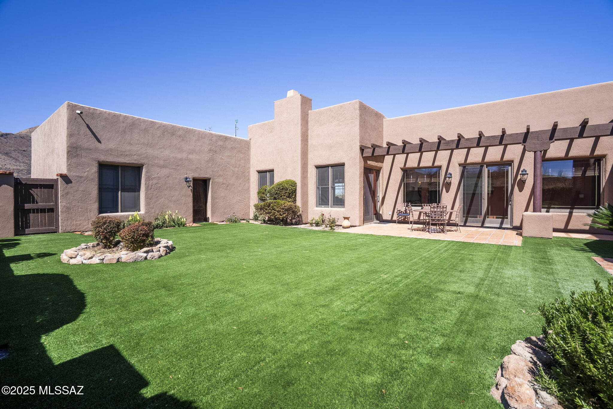 1265 Morning Star Drive Rio Rico, AZ 85648 - Photo 27 of 50 a view of a house with backyard and porch