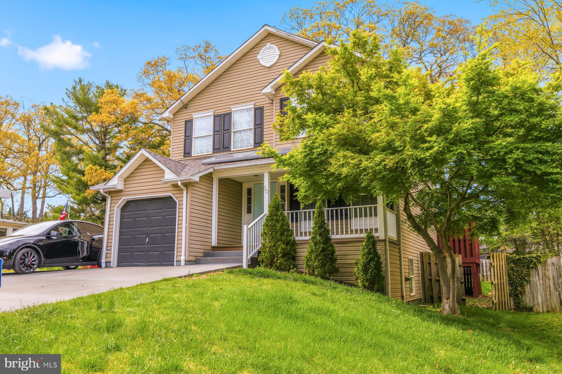 50 Robinson Landing Road Severna Park, MD 21146 - Photo 15 of 38 a front view of a house with a garden