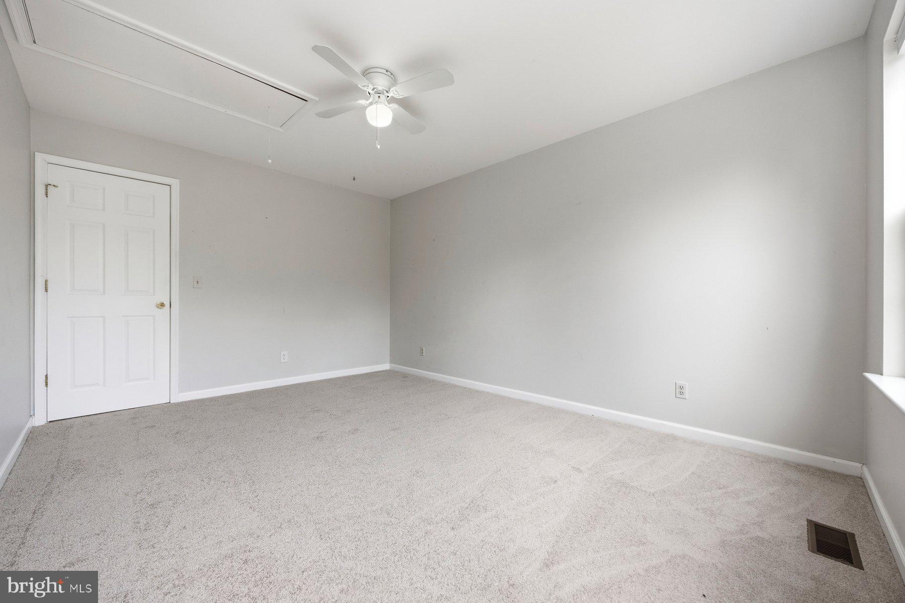 50 Robinson Landing Road Severna Park, MD 21146 - Photo 20 of 38 an empty room with a ceiling fan and a window