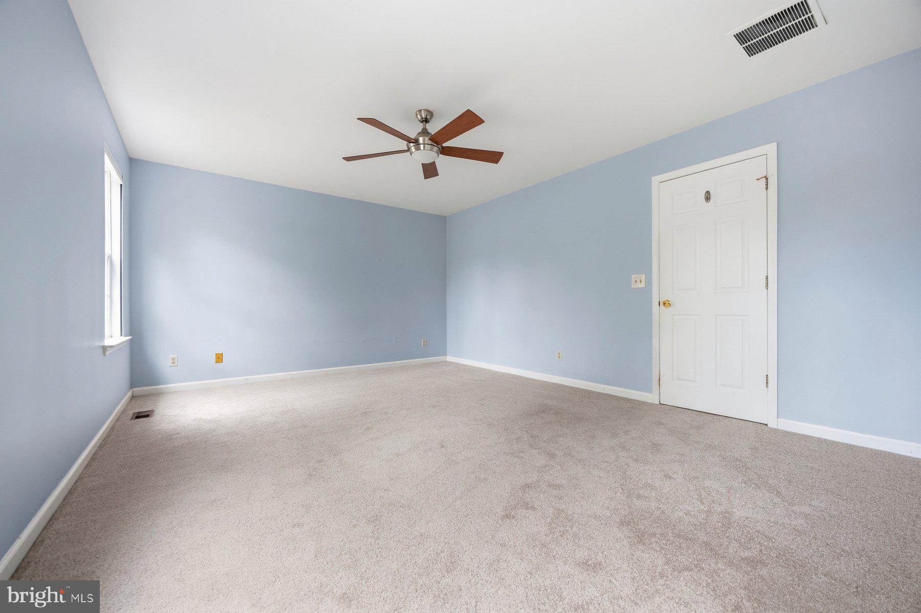 50 Robinson Landing Road Severna Park, MD 21146 - Photo 27 of 38 an empty room with windows and fan
