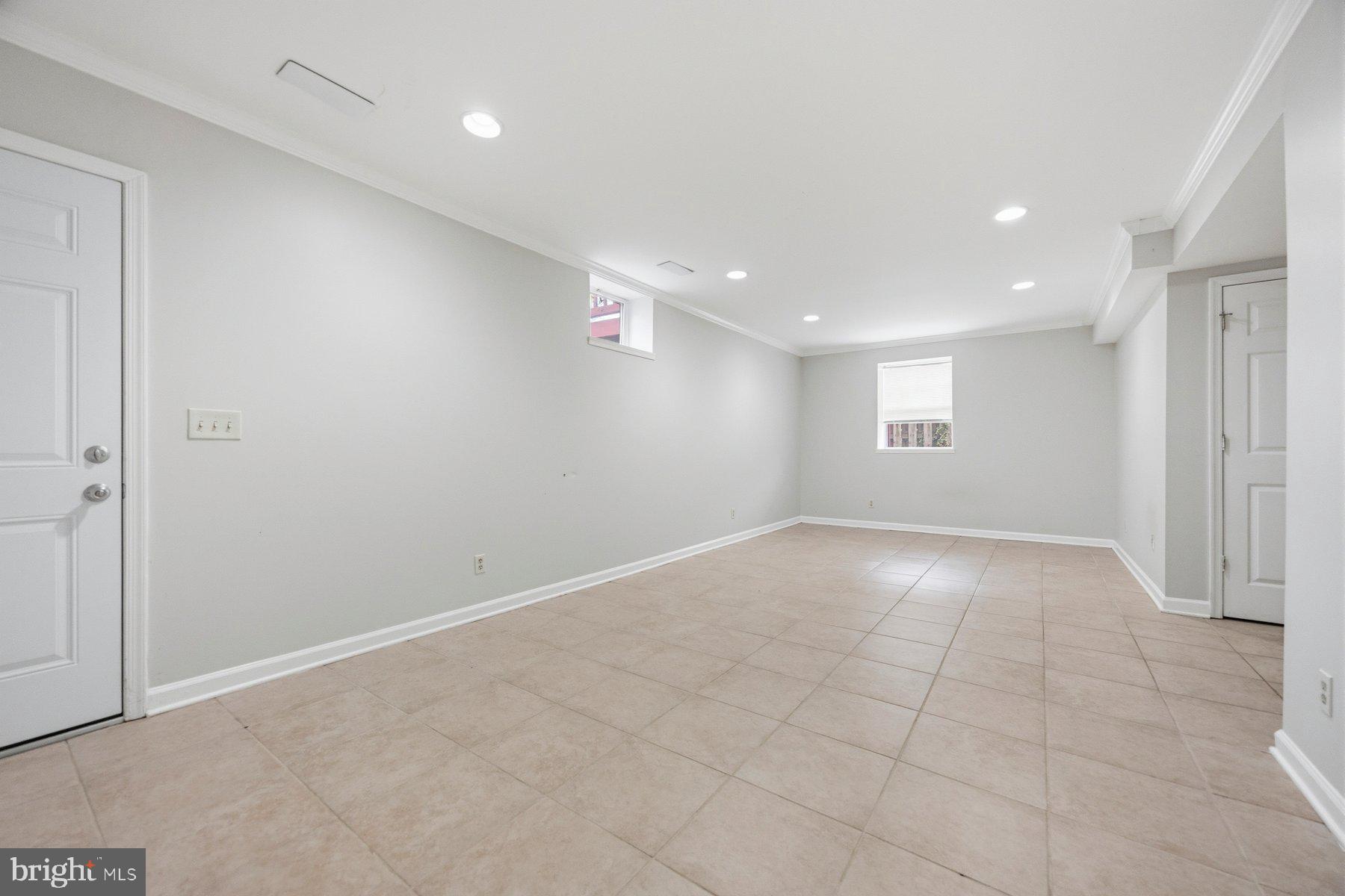 50 Robinson Landing Road Severna Park, MD 21146 - Photo 30 of 38 an empty room with windows and entrance to other room