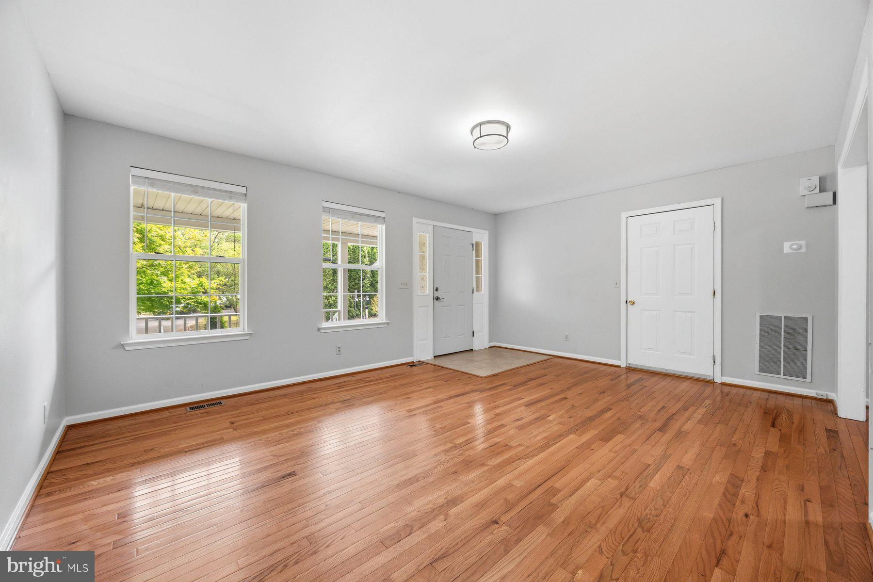 50 Robinson Landing Road Severna Park, MD 21146 - Photo 7 of 38 a view of an empty room with wooden floor and a window