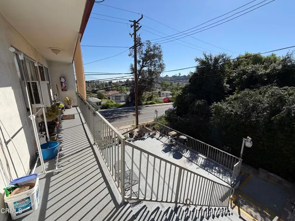 a view of balcony with furniture