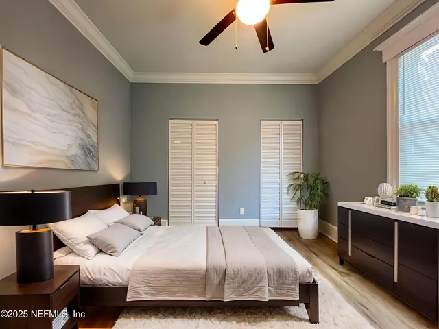 a bedroom with a bed and window