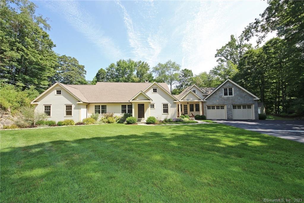 208 Florida Road Ridgefield, CT 06877 - Photo 1 of 1 a front view of a house with a garden